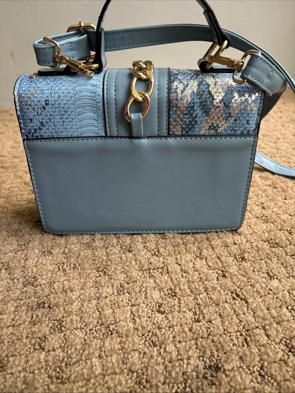 Faux snakeskin crossbody blue purse new with minor mark on bottom